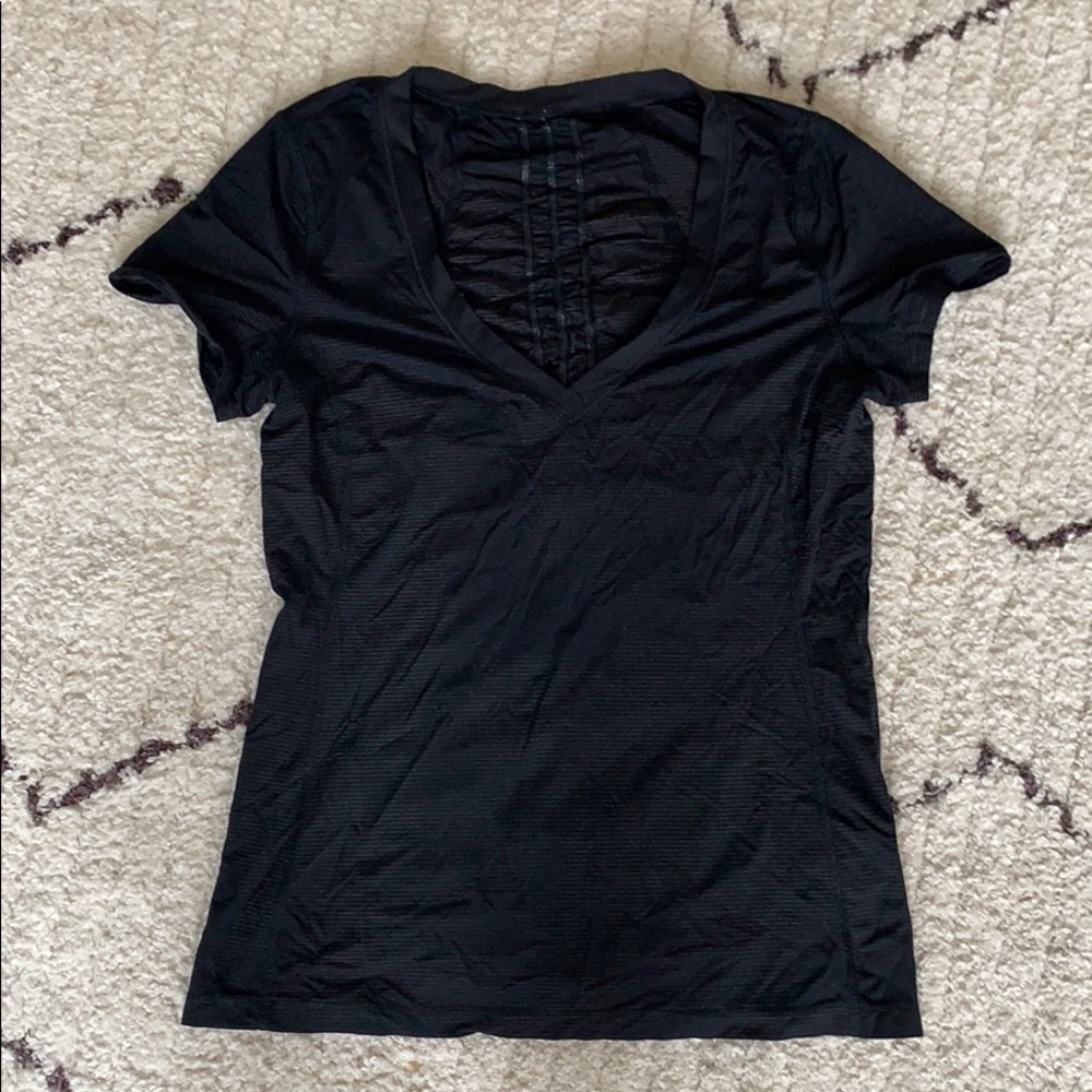 Lululemon top with ruffle back. Size 8